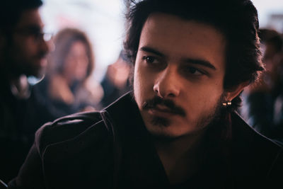 Close-up of young man looking away