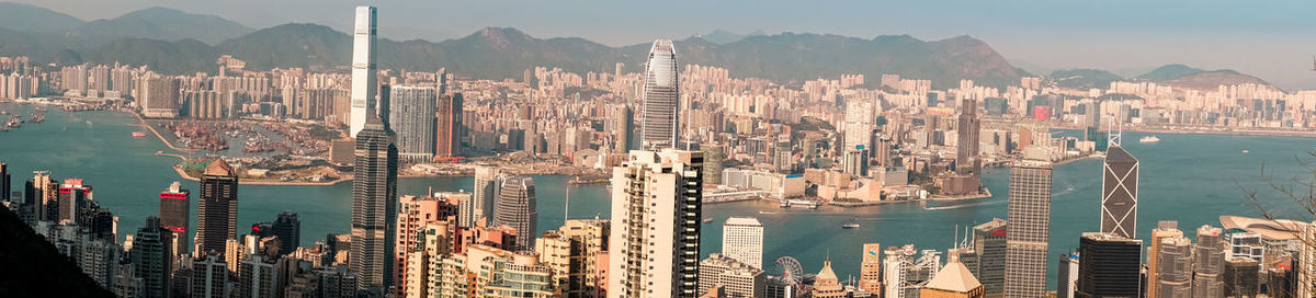 Panoramic view of city and sea against sky