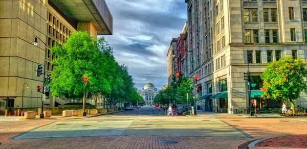 Street in city against sky