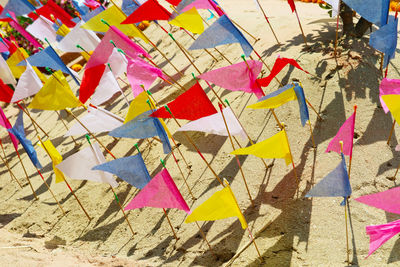 High angle view of multi colored umbrellas on paper