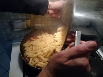 Close-up of man preparing food in kitchen