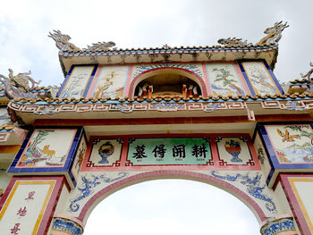 Low angle view of ornate building against sky