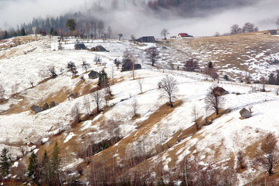 Scenic view of frozen landscape against sky