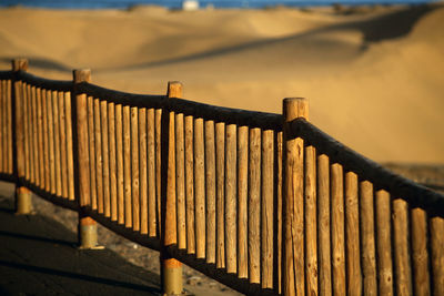 Metal fence against bridge