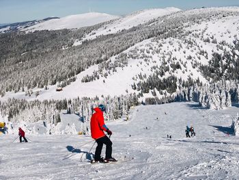 Man skiing on snow covered mountain