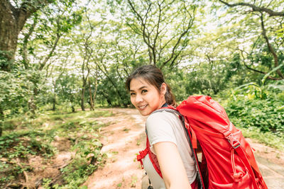 Portrait of smiling young woman outdoors