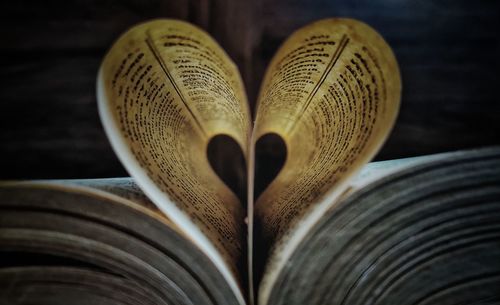 Close-up of heart shape on book