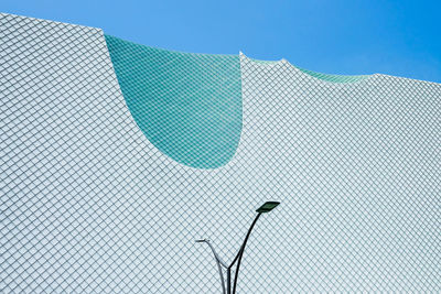 Low angle view of swimming pool against building