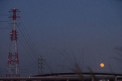 Low angle view of suspension bridge against sky