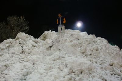 Low angle view of man skiing on snow