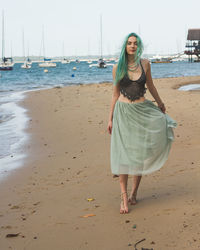 Portrait of smiling young woman on beach