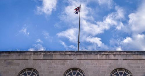 Low angle view of flag against sky