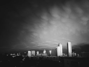 Skyscrapers in city against sky