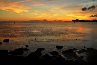 Scenic view of sea at sunset