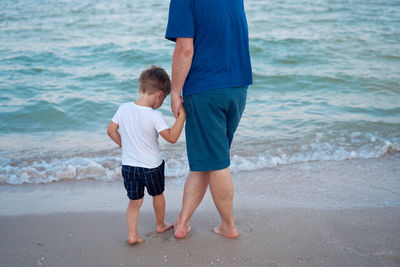 Father and son on beach