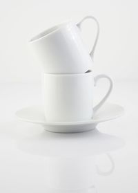 Close-up of coffee cup on white background