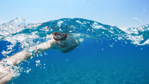 Man swimming in sea