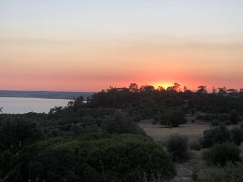 Scenic view of landscape against sky during sunset