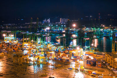 High angle view of illuminated cityscape at night