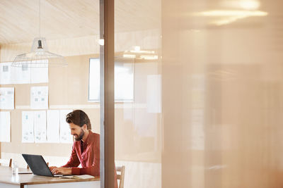 Businessman using laptop at office