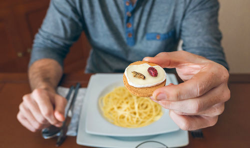 Midsection of man holding ice cream