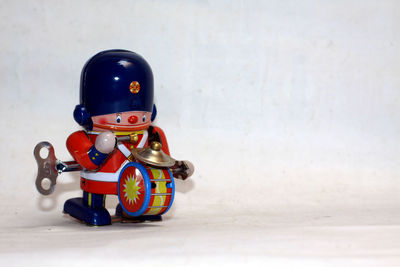 Close-up of toy car on table against wall