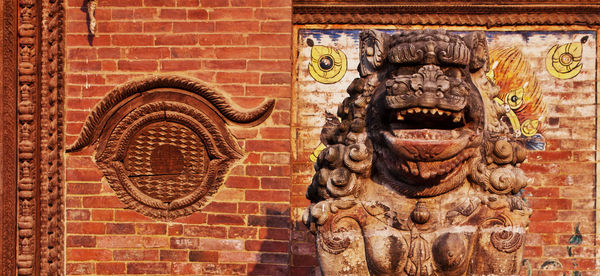 Close-up of statue on wall