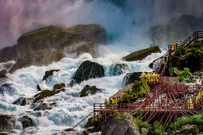 Low angle view of waterfall against sky at night