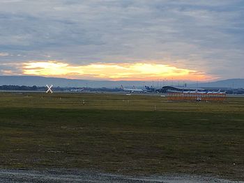 Scenic view of beach against sky during sunset