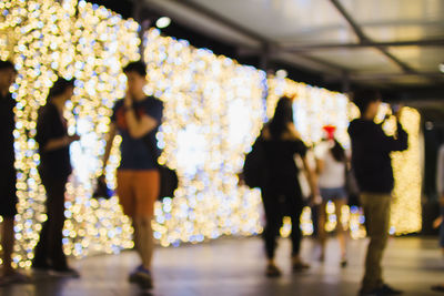 Defocused image of people during christmas