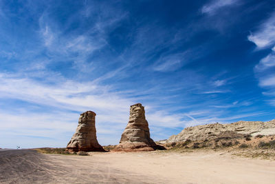 View of rock formation on desert against sky