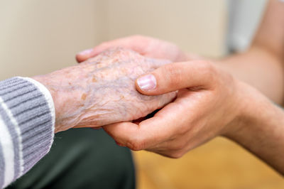 Cropped hand of man washing hands