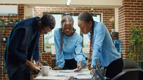 Business colleagues working at table