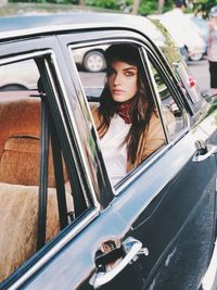 Portrait of woman sitting in car