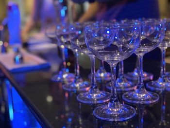 Close-up of wine glasses on table