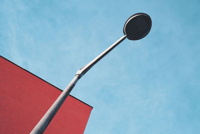 Low angle view of street light against sky