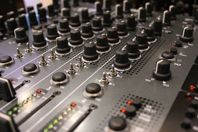 Close-up of sound mixer in studio