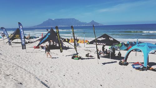 Scenic view of beach against blue sky