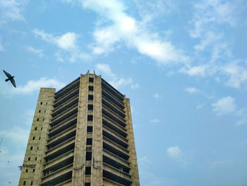 Low angle view of under construction building against sky