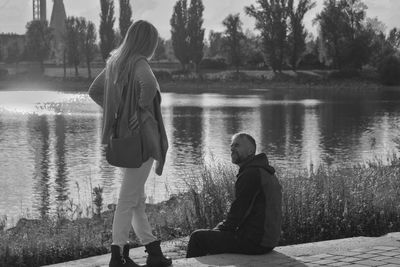 Man and woman by lake