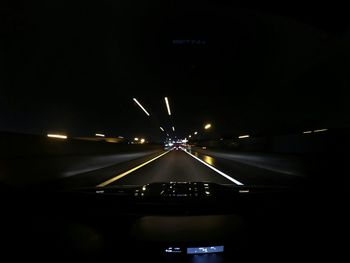 Cars on road at night
