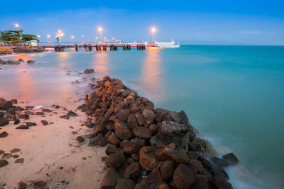 Scenic view of sea against sky at night