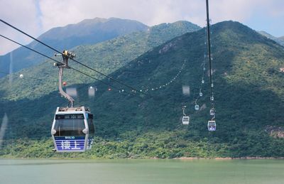 Overhead cable car against mountains