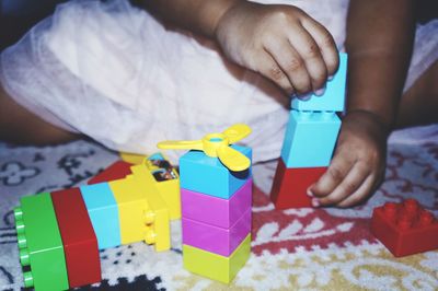 Close-up of baby playing with toy