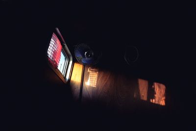Low angle view of illuminated building against sky at night