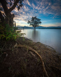 Scenic view of lake against sky during sunset