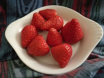 High angle view of strawberries in bowl on table