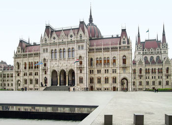 Facade of historic building against clear sky