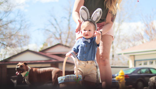 Easter family fun portrait of smal boy wearing bunny ears