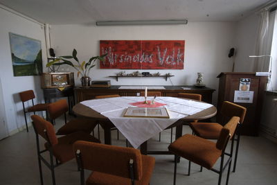 Empty chairs and tables in restaurant